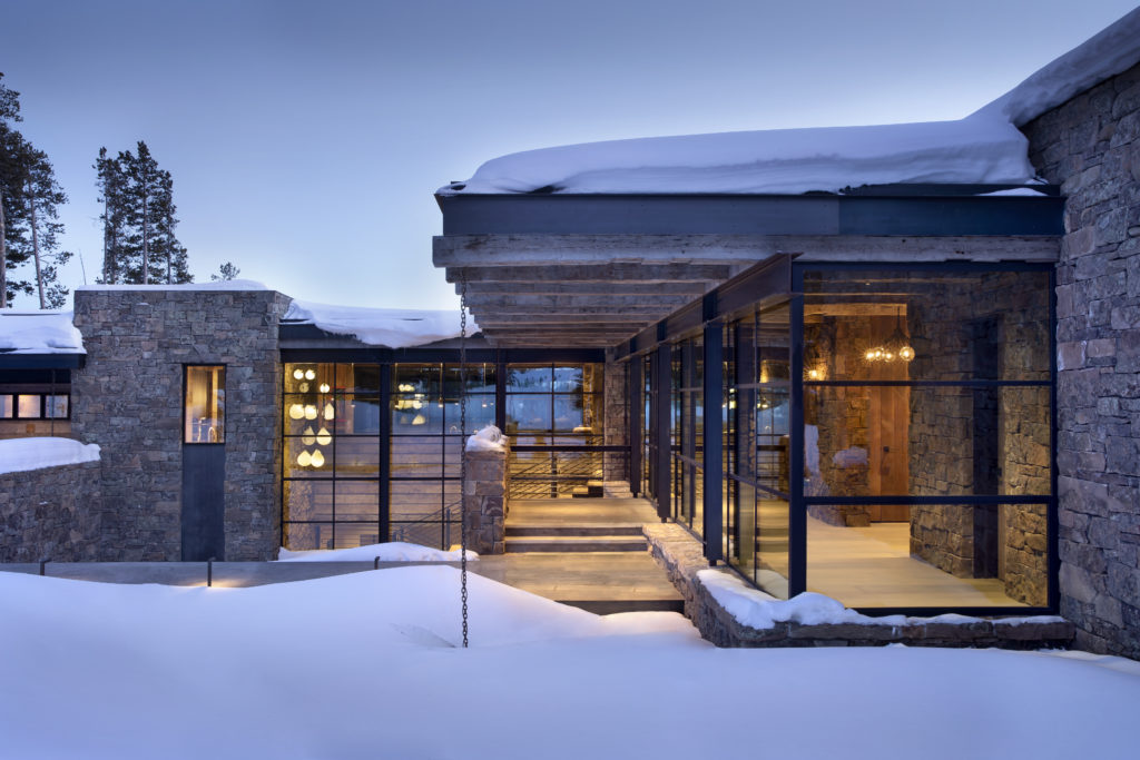 Home in winter time with custom steel windows.